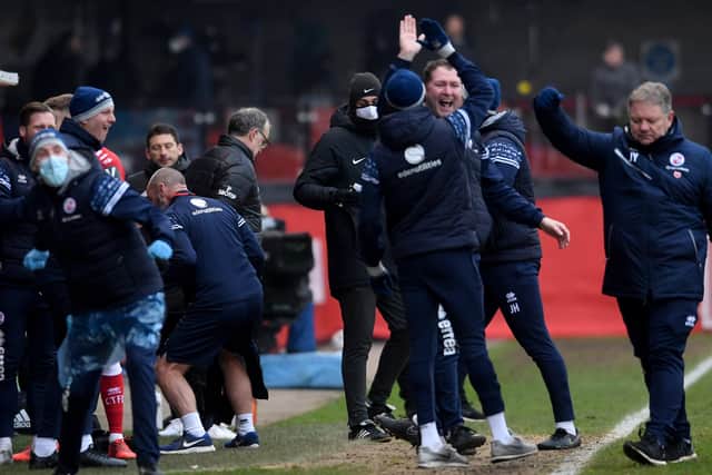 Marcelo Bielsa turns away as the Crawley management celebrate. Picture by Simon Hulme