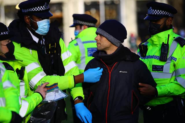 Police at a recent anti-lockdown protest in London.