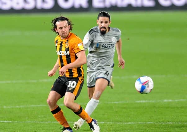 Hull City's George Honeyman is challenged by Burton Albion's  Ryan Edwards at the KCOM Stadium in November. Picture: Simon Hulme