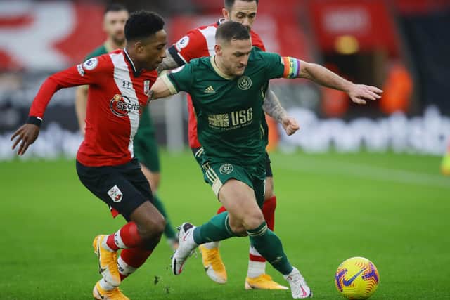 Sheffield United's Billy Sharp battles with Southampton's Kyle Walker-Peters at St Mary's Stadium. Picture: David Klein/Sportimage