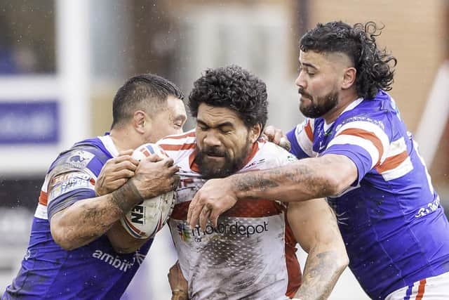 Popular: Robins' Mose Masoe, centre, was a popular player and his injury led to various fundraising schemes. But the former forward admits he is unsure how he will provide for his family in future. Picture by Allan McKenzie/SWpix.com