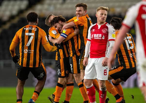 Lewie Coyle and Hull City celebrate his injury-time winner.  Picture Bruce Rollinson