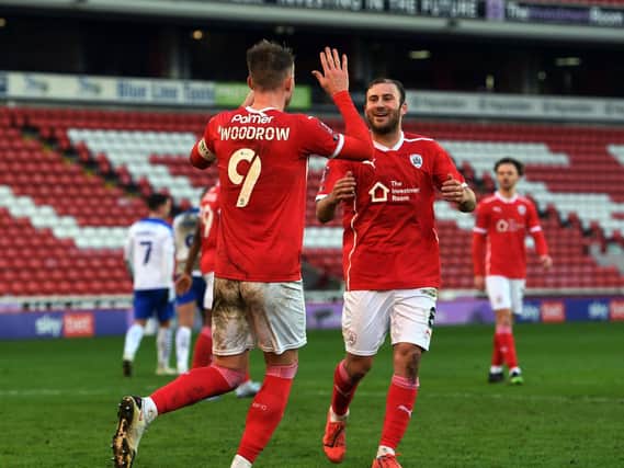 WIN: Cauley Woodrow celebrates with Herbie Kane as Barnsley knock Tranmere Rovers out of the FA Cup