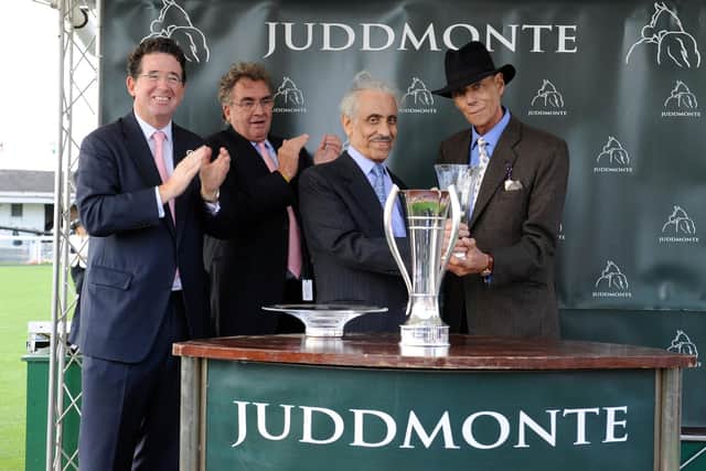Perince Khalid Abdullah presents the 2012 Juddmonte International trophy to Sir Henry Cecil.