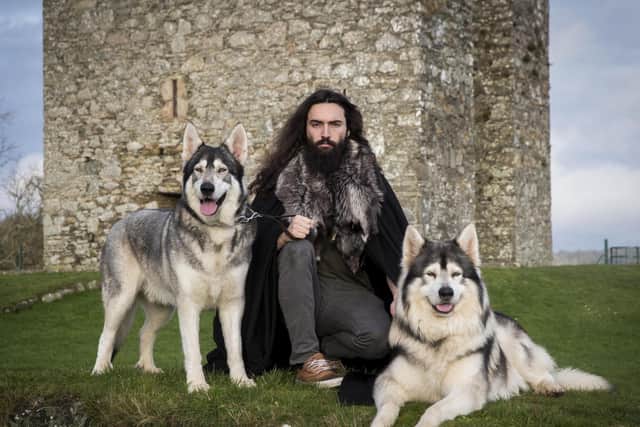 Dire wolves - oversized, extra-powerful wolves, have been made famous in the popular fantasy show TV show Game of Thrones Pictured, William Mulhall from Co Down in Northern Ireland with Thor (left) and Odin, two Northern Inuit dogs he owns which played 'dire wolves' in the hit HBO fantasy drama, Game Of Thrones. Photo credit: Liam McBurney/PA Wire