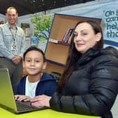 David Richards has helped pioneer the Laptops For Kids scheme in Sheffield that ensures pupils such as Castro Hart-Richards, pictured with his mother Vikki Hart and Athelstan Primary School assistant headteacher James Mills.