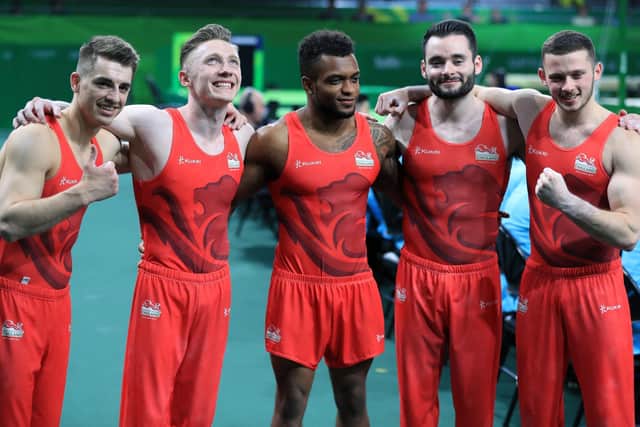 Nile wilson, second left, with Max Whitlock, Courtney Tulloch, James Hall and Dominick Cunningham celebrate winning gold for England at the 2018 Commonwealth Games on Australia's Gold Coast. Picture: Mike Egerton/PA