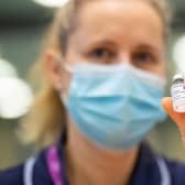 An NHS staff member prepares to administer the Oxford/AstraZeneca Covid-19 vaccine. The UK aims to vaccinate 15 million people by mid-February. Photo credit: Dominic Lipinski / Getty Images