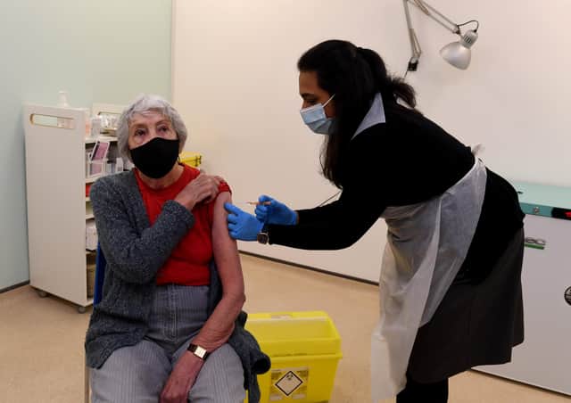 Victoria Watling receives her first vaccine at the Boots pharmacy in Halifax. Photo: Simon Hulme.