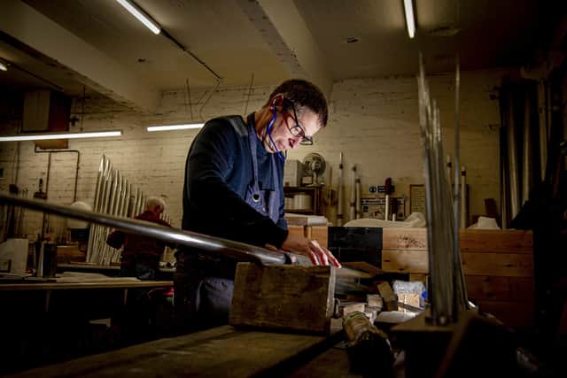 Terry Doyle at Shires Organ Pipes in Bramley, rounding out a 16ft reed pipe.  Picture: Tony Johnson