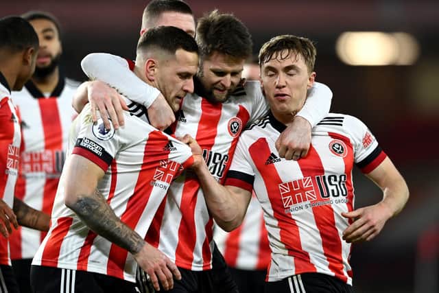 BUOYANT: Sheffield United's Billy Sharp celebrates scoring his side's first goal of the game with Oliver Norwood and Ben Osborn. Picture: Stu Forster/PA