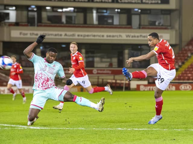 Barnsley's Victor Adeboyejo fires his shot just over the bar.  Picture Tony Johnson