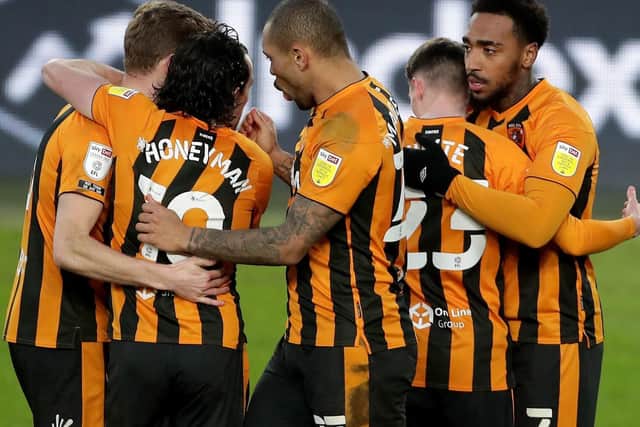 The Hull players celebrate after taking a 1-0 lead against visiting Blackpool.