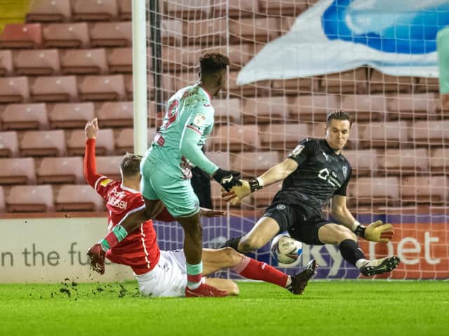 Swansea City's Jamal Lowe scores their second goal after a costly mix-up in Barnsley's defence. (PIC: TONY JOHNSON)