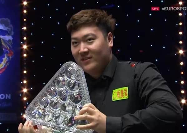 TROPHY TIME: New Masters champion Yan Bingtaso with the trophy after pocketing a £250,000 cheque. Picture: Sportsbeat