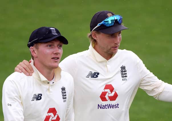 Victory: England's Joe Root, right, and Dom Bess.