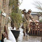 A soldier from The Highlanders, 4th Battalion, the Royal Regiment of Scotland in Mytholmroyd assisting with flood defences, in the Upper Calder Valley in West Yorkshire ahead of Storm Dennis last February. Picture: Danny Lawson/PA Wire.
