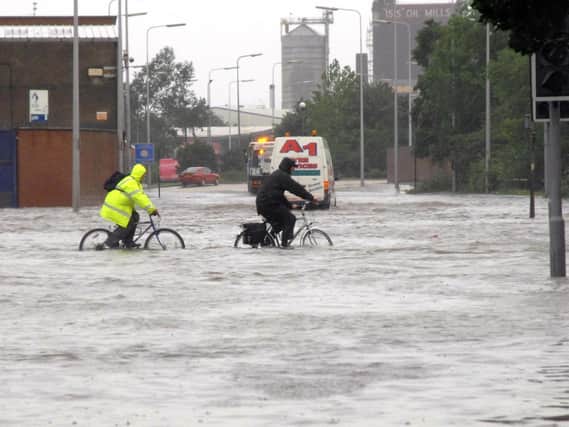 The city of Hull was pummelled by rain for hours on June 25, 2007. Nearly every one of the city's 98 schools were damaged by the heavy rainfall, with thousands of people forced from their homes.
This picture was taken from June 25, 2007, with people cycling through water on Cleveland Street in Hull.