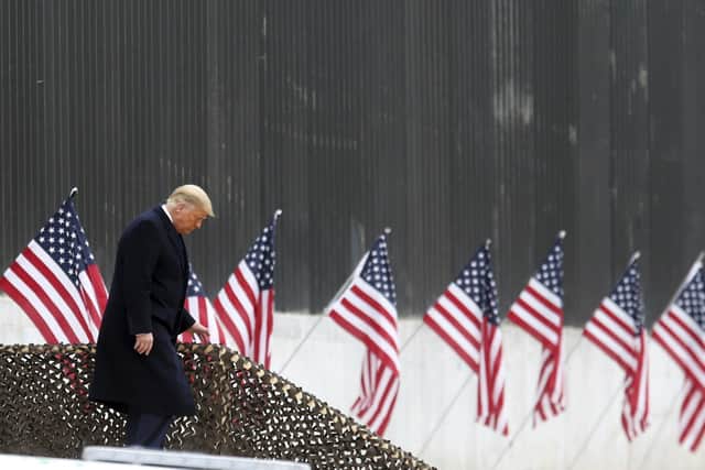 President Donald Trump walks down the steps before a speech near a section of the U.S.-Mexico border wall, Tuesday, Jan. 12, 2021, in Alamo, Texas. (Delcia Lopez/The Monitor via AP)