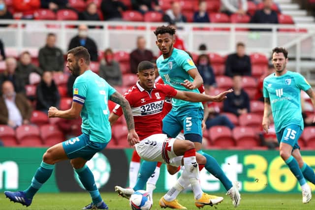 CLOSING IN: Middlesbrough's Ashley Fletcher (second left). Picture: Owen Humphreys/PA