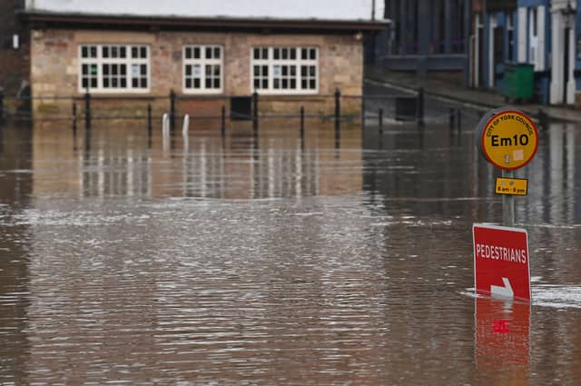 A flooded street is seen in York on January 19, 2021 as Storm Christoph brings heavy rains across England. (Photo by Paul ELLIS / AFP)
