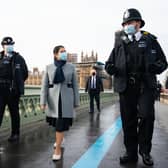 Home Secretary Priti Patel walks across Westminster Bridge whilst on patrol with Metropolitan Police officers in central London, to hear about about Covid enforcement. Photo: PA