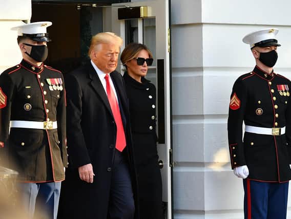 Former US President Donald Trump and wife Melania make their way to board Marine One before departing from the South Lawn of the White House in Washington. Photo: MANDEL NGAN/AFP via Getty Images