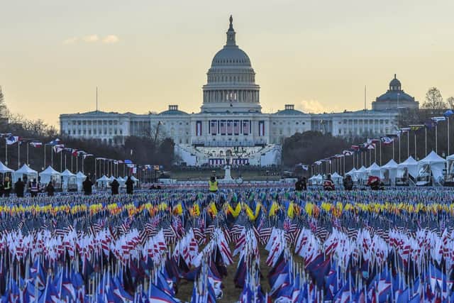 200,000 small US, state and territorial flags, intended to honor the nearly 400,000 Americans killed in the coronavirus pandemic. Photo: Getty