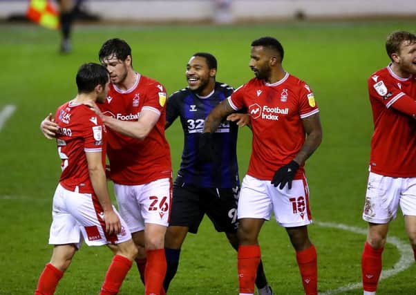 Nottingham Forest's Yuri Ribeiro (left) is separated from Middlesbrough goal-scorer Britt Assombalonga at the City Ground. Picture: Tim Goode/PA