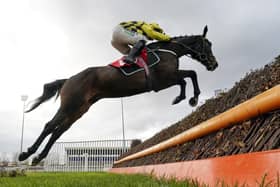 Nico de Boinville riding Shishkin on their way to winning TheRacing TV Beginners' Chase at Kempton Park Racecourse.