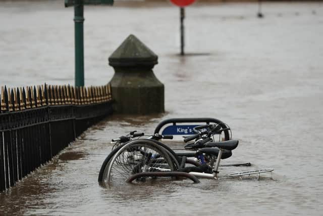 Partially submerged bicycles in a flooded part of York, in anticipation of Storm Christoph which is set to bring further flooding, gales and snow to parts of the UK. Photo: PA