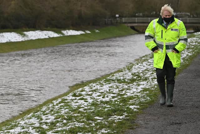 Prime Minister Boris Johnson during a visit to a storm basin near the River Mersey in Didsbury, Manchester, to view the flood defences put in place for Storm Christoph which has caused widespread flooding across the UK.  Photo: PA