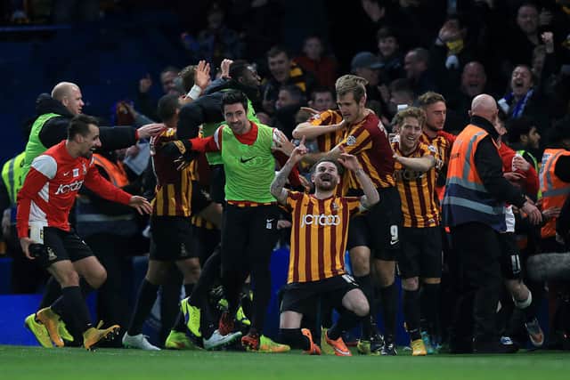 BIG SHOCK: Bradford City's Mark Yeates (front) celebrates with team-mates after scoring his side's fourth goal against Chelsea at Stamford Bridge in January 2015. Picture: John Walton/PA