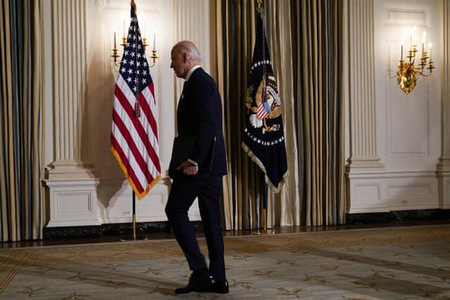 President Joe Biden leaves after attending a virtual swearing in ceremony of political appointees from the State Dining Room of the White House.