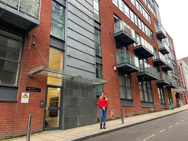 First-time buyer Olivia Hill outside the apartment block where she lives  in Sheffield that has unsafe cladding