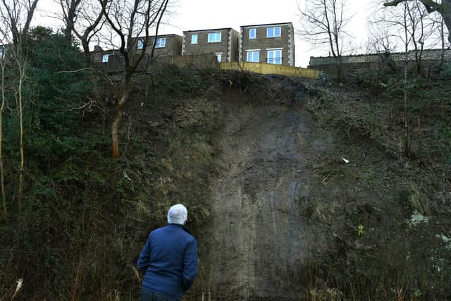 Homes on Manchester Road, Slaithwaite, which are sitting precariously near to the edge of a landslide on the banks of the River Colne