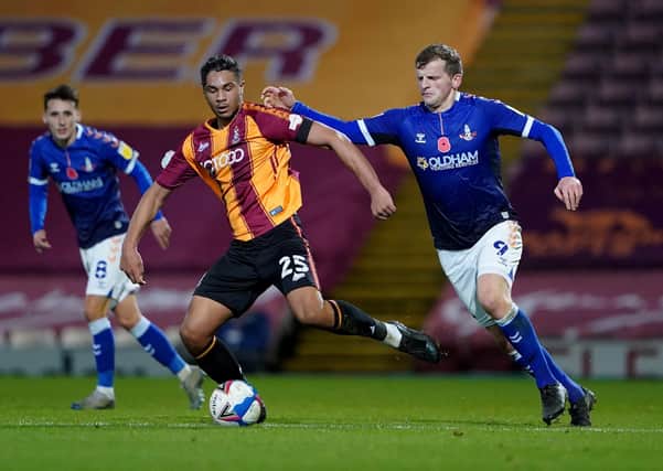 Bradford’s Jorge Sikora (left) and Oldham’s Danny Rowe, who has now joined the Bantams.