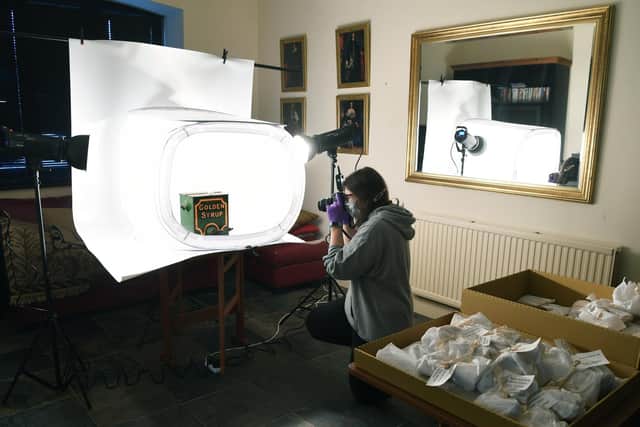 Project officer Alice Rose gets ready for the Annie Marchant Kitchen and dairy exhibition at Kiplin Hall and Gardens, near Scorton, Richmond.
Pictured photographing the exhibits. Picture: Jonathan Gawthorpe.