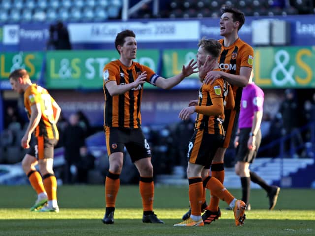 Hull City players celebrate their side's first goal of the game, scored by Portsmouth's Jack Whatmough at Fratton Park. Picture: Kieran Cleeves/PA