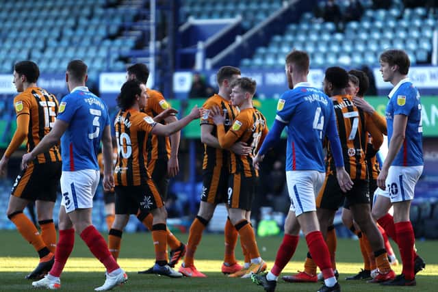 Hull City players celebrate their side's first goal of the game, scored by Portsmouth's Jack Whatmough. Picture: Kieran Cleeves/PA