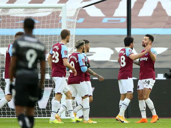 West Ham players celebrate with Pablo Fornals (right) after his opener against Doncaster Rovers. Picture: Nigel French/PA.