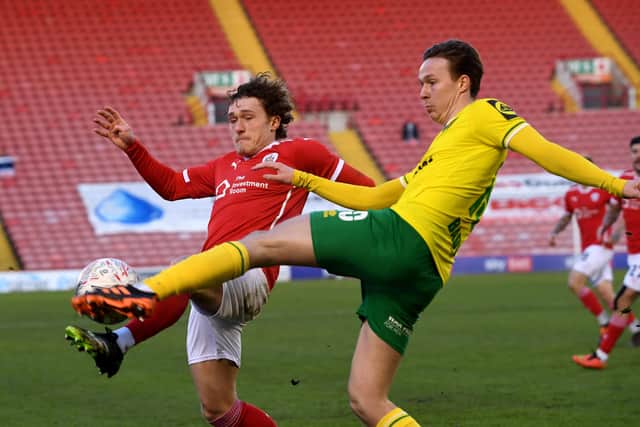 Barnsley's Callum Styles battles with Norwich City's Kieran Dowell at Oakwell on Saturday. Picture by Simon Hulme