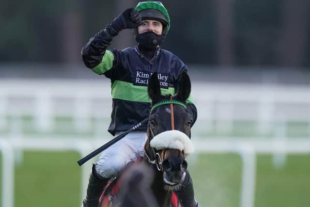 David Bass riding First Flow celebrate after winning the Matchbook Betting Exchange Clarence House Chase.