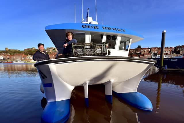 Whitby has a new lobster fishing boat ' Our Henry' Business partners Terry Pearson and Luke Russell on the vessel in Whitby  Picture: Richard Ponter
