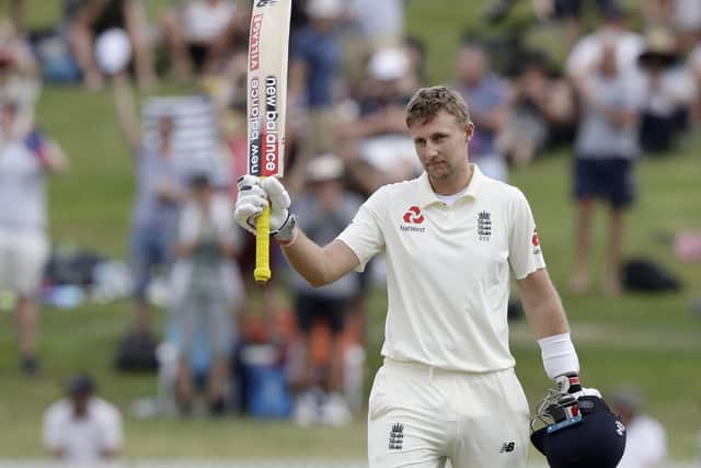 England's Joe Root celebrates scoring a century on day three of the second cricket test between England and New Zealand at Seddon Park in December 2019. Picture: AP/Mark Baker