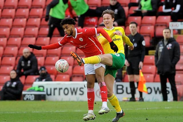 PRESSURE: Barnsley's Romal Palmer is challenged by Norwich City's Kieran Dowell. Picture by Simon Hulme