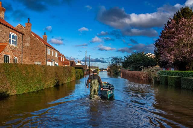 Resident David Goodwin, keeps hold of his canoe whilst out on patrol along Back Lane, East Cowick on February29 2020 Picture: James Hardisty