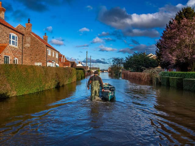 Resident David Goodwin, keeps hold of his canoe whilst out on patrol along Back Lane, East Cowick on February29 2020 Picture: James Hardisty