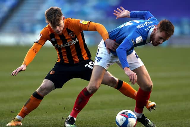 Hull City's Keane Lewis-Potter (left) and Portsmouth's Tom Naylor (Picture: PA)