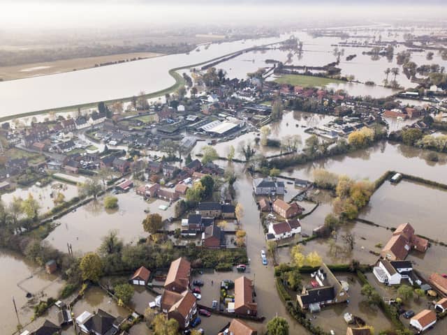 The village of Fishlake, Doncaster, submerged under flood water, in November 2019.   Around 1,000 homes and 565 businesses in South Yorkshire were destroyed when a "biblical" downpour swelled rivers to bursting point. Photo credit: Tom Maddick / SWNS